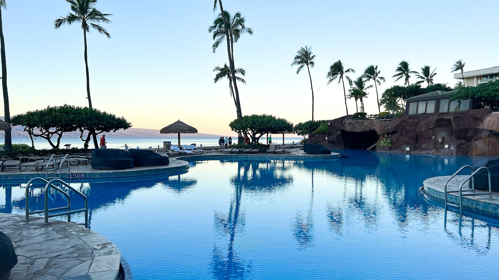 Beautiful Hawaii residential home with backyard swimming pool on a sunny day
